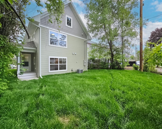 729 Burr St N, Saint Paul, MN 55130 - rear view of property featuring central AC unit