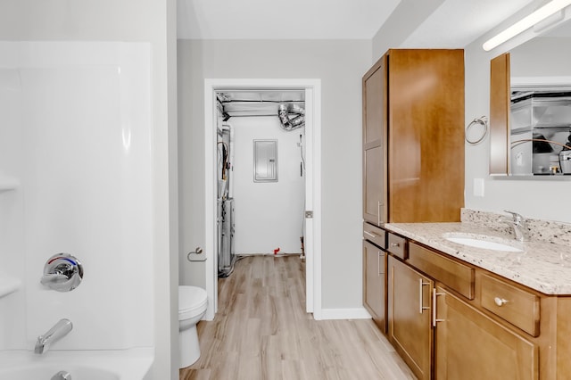 729 Burr St N, Saint Paul, MN 55130 - full bathroom with vanity, wood finished floors, bathing tub / shower combination, toilet, and electric panel