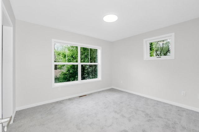729 Burr St N, Saint Paul, MN 55130 - carpeted spare room featuring healthy amount of natural light and baseboards