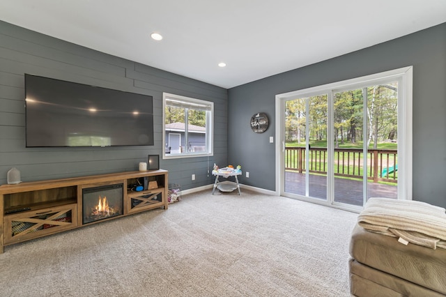 331 Locust St, Duluth, MN 55811 - carpeted living room with baseboards, recessed lighting, wooden walls, and an accent wall