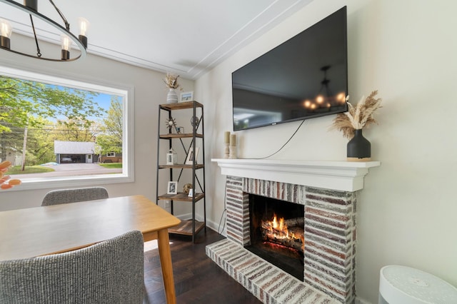 331 Locust St, Duluth, MN 55811 - dining space with a brick fireplace, wood finished floors, and baseboards