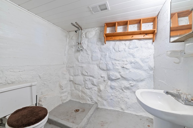 331 Locust St, Duluth, MN 55811 - full bath featuring a shower stall, unfinished concrete flooring, toilet, and a sink