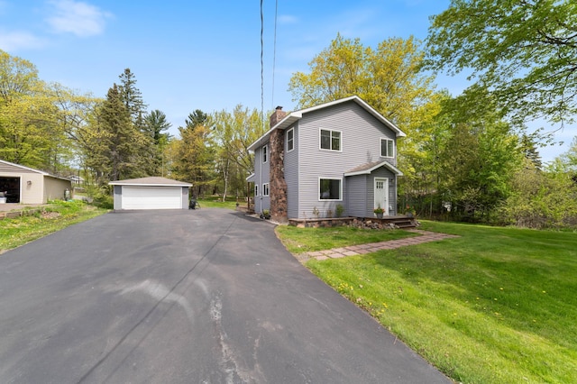 331 Locust St, Duluth, MN 55811 - view of front of property featuring a chimney, a detached garage, an outbuilding, and a front yard