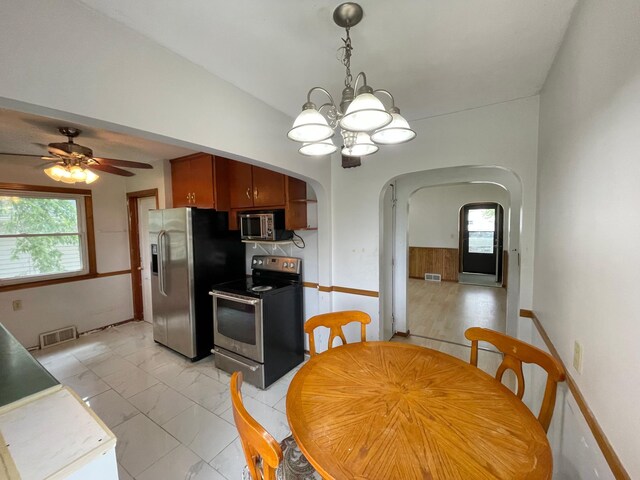 111 Park Ave, Springfield, MN 56087 - dining room featuring arched walkways, a chandelier, plenty of natural light, and ceiling fan