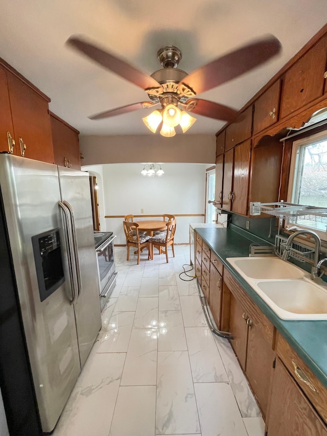 111 Park Ave, Springfield, MN 56087 - kitchen with appliances with stainless steel finishes, a sink, brown cabinetry, and light marble finish floors
