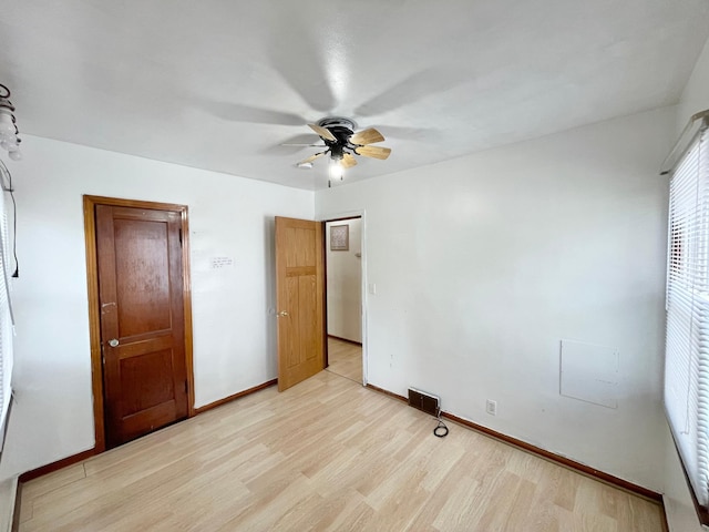 111 Park Ave, Springfield, MN 56087 - unfurnished bedroom featuring light wood-style flooring, baseboards, and ceiling fan
