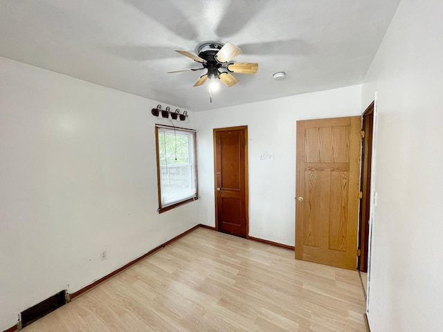 111 Park Ave, Springfield, MN 56087 - unfurnished bedroom featuring light wood finished floors, ceiling fan, and baseboards