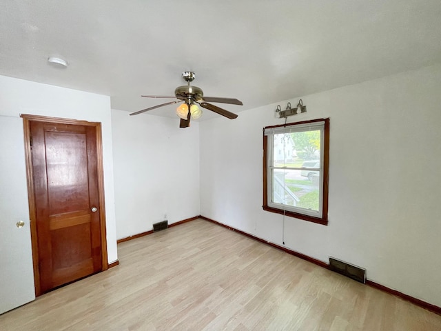 111 Park Ave, Springfield, MN 56087 - spare room with light wood-style floors, a ceiling fan, and baseboards