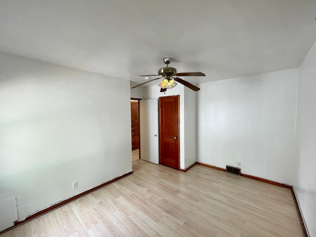 111 Park Ave, Springfield, MN 56087 - unfurnished room with light wood-style floors, ceiling fan, and baseboards