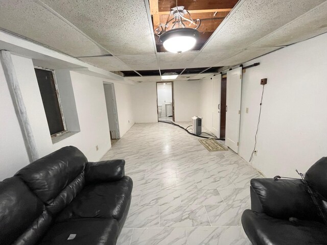 111 Park Ave, Springfield, MN 56087 - finished below grade area featuring light marble finish flooring and a drop ceiling