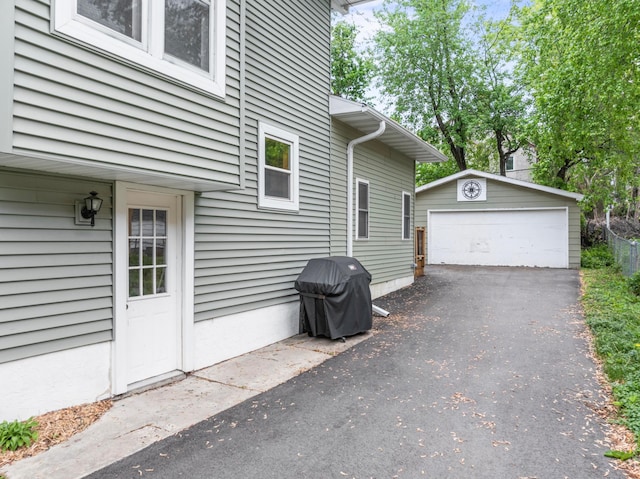 842 2nd St NW, Rochester, MN 55901 - view of side of home with an outdoor structure and a detached garage