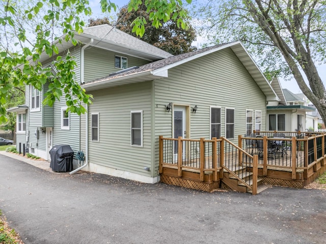 842 2nd St NW, Rochester, MN 55901 - back of property featuring a deck and roof with shingles