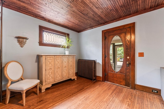 842 2nd St NW, Rochester, MN 55901 - foyer entrance with radiator heating unit, ornamental molding, light wood-style flooring, baseboards, and wood ceiling