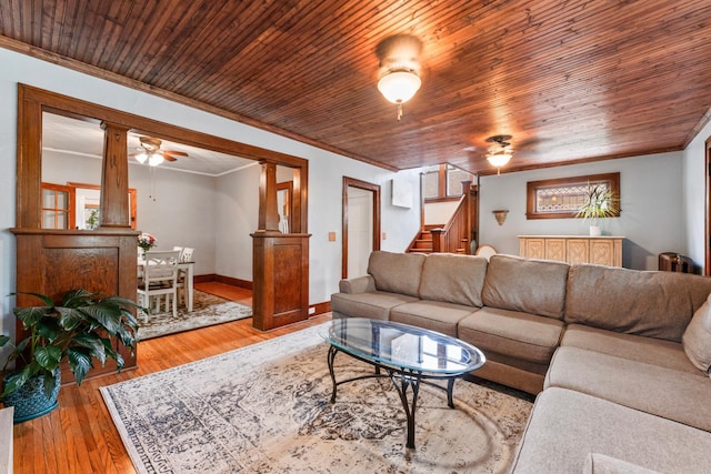 842 2nd St NW, Rochester, MN 55901 - living area featuring ornamental molding, stairway, light wood-style flooring, baseboards, and decorative columns