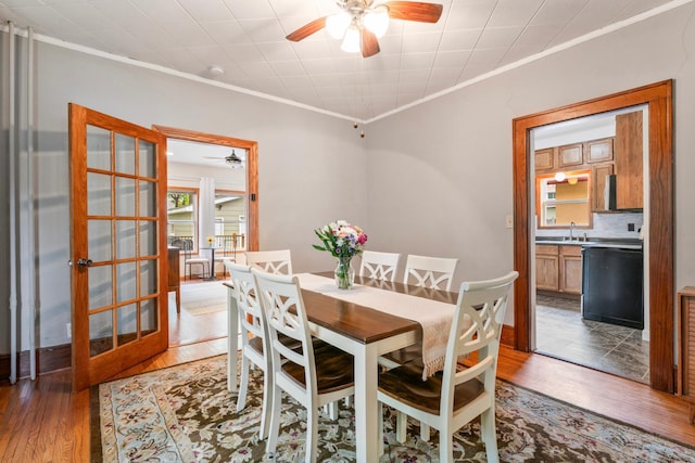 842 2nd St NW, Rochester, MN 55901 - dining space featuring ceiling fan, crown molding, and wood finished floors