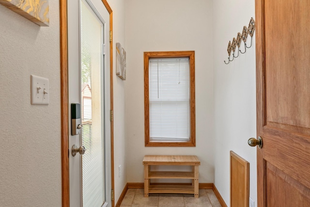 842 2nd St NW, Rochester, MN 55901 - doorway with light tile patterned floors and baseboards