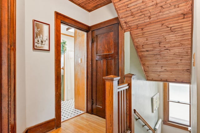 842 2nd St NW, Rochester, MN 55901 - hallway with an upstairs landing, wood ceiling, light wood-style flooring, and baseboards