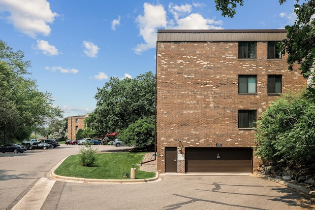 7510 Cahill Rd Unit 217B, Edina, MN 55439 - view of property with an attached garage