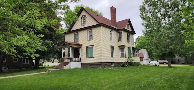 2753 Maple Ave, Slayton, MN 56172 - view of front of home featuring a chimney and a front lawn