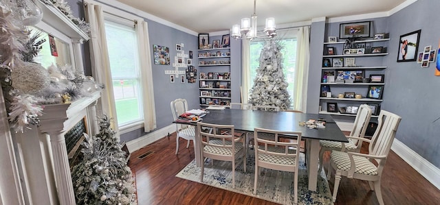 2753 Maple Ave, Slayton, MN 56172 - dining room featuring a chandelier, wood finished floors, plenty of natural light, baseboards, and crown molding