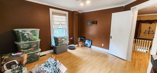 2753 Maple Ave, Slayton, MN 56172 - unfurnished room with wood finished floors, crown molding, and baseboards