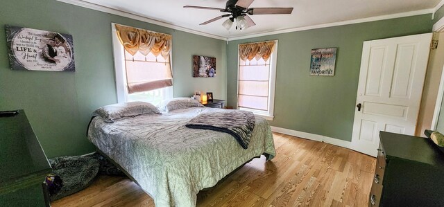 2753 Maple Ave, Slayton, MN 56172 - bedroom with ornamental molding, light wood-style flooring, baseboards, and a ceiling fan