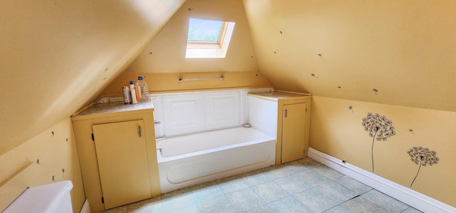 2753 Maple Ave, Slayton, MN 56172 - bathroom with a skylight, a garden tub, and lofted ceiling