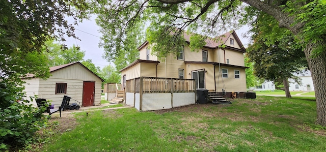 2753 Maple Ave, Slayton, MN 56172 - rear view of house with a yard and a wooden deck