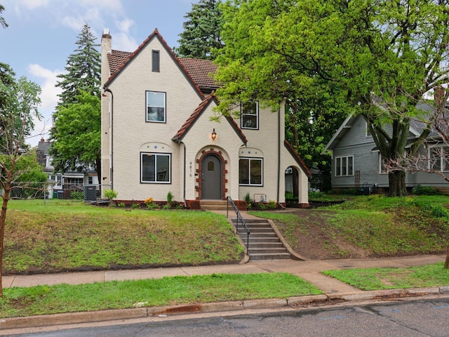 4816 3rd Ave S, Minneapolis, MN 55419 - tudor-style house featuring a chimney and a tiled roof