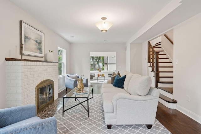 4816 3rd Ave S, Minneapolis, MN 55419 - living room featuring wood finished floors, stairway, baseboards, and a brick fireplace