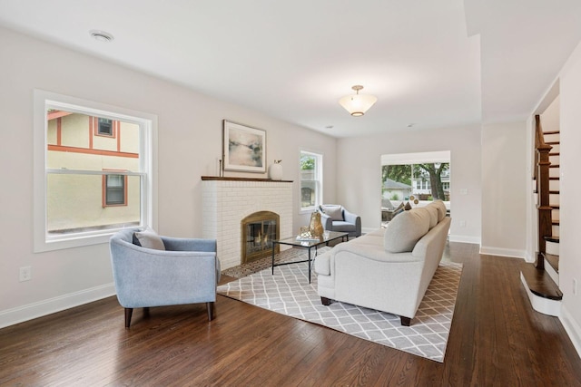 4816 3rd Ave S, Minneapolis, MN 55419 - living room with wood finished floors, baseboards, a brick fireplace, and stairs