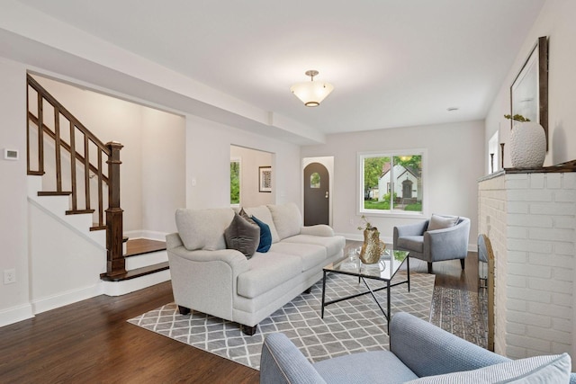 4816 3rd Ave S, Minneapolis, MN 55419 - living area with wood finished floors, baseboards, stairway, and a brick fireplace