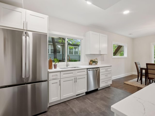 4816 3rd Ave S, Minneapolis, MN 55419 - kitchen featuring stainless steel appliances, a sink, baseboards, white cabinetry, and recessed lighting