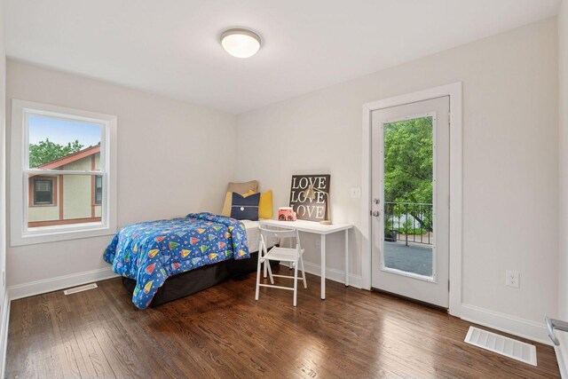 4816 3rd Ave S, Minneapolis, MN 55419 - bedroom featuring access to exterior, multiple windows, wood finished floors, and baseboards