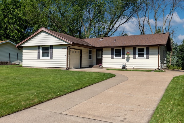 11748 Bittersweet St NW, Coon Rapids, MN 55433 - ranch-style home featuring concrete driveway, an attached garage, and a front lawn