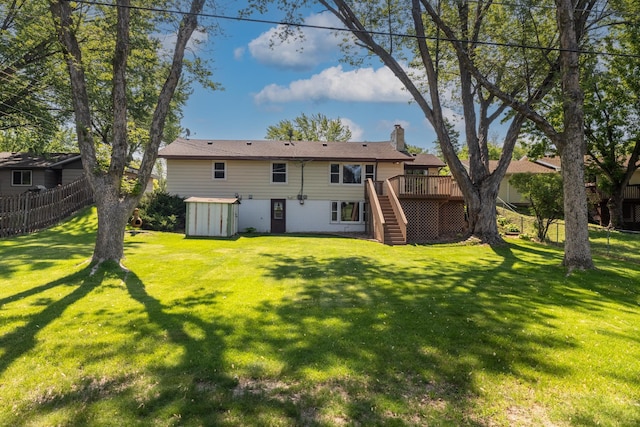11748 Bittersweet St NW, Coon Rapids, MN 55433 - back of property with stairs, a wooden deck, and a chimney