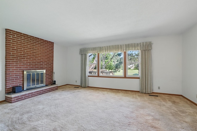 11748 Bittersweet St NW, Coon Rapids, MN 55433 - unfurnished living room featuring carpet, baseboards, and a fireplace