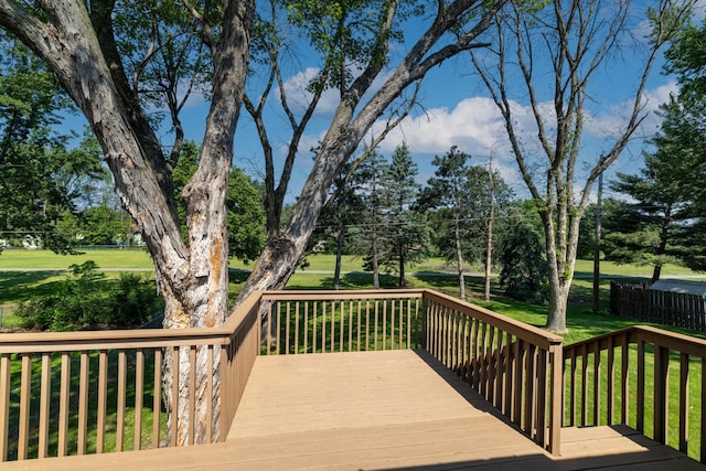 11748 Bittersweet St NW, Coon Rapids, MN 55433 - wooden terrace featuring view of wooded area