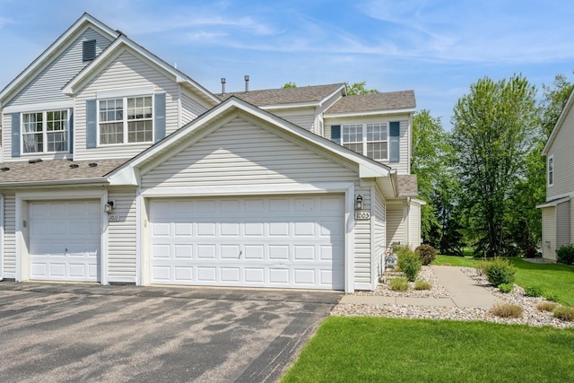 1005 Providence Dr, Shakopee, MN 55379 - view of front of home featuring driveway and roof with shingles