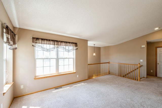 1005 Providence Dr, Shakopee, MN 55379 - carpeted spare room featuring a textured ceiling and baseboards