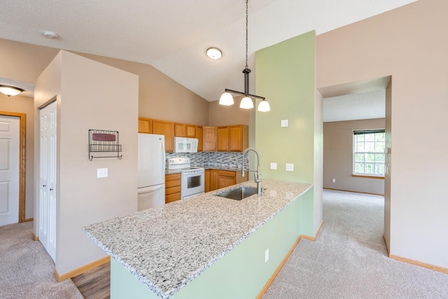1005 Providence Dr, Shakopee, MN 55379 - kitchen featuring white appliances, a sink, a peninsula, light colored carpet, and baseboards