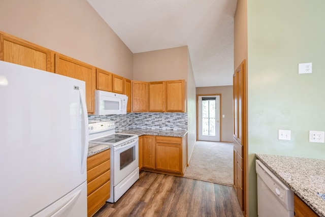 1005 Providence Dr, Shakopee, MN 55379 - kitchen with white appliances, wood finished floors, decorative backsplash, light stone counters, and baseboards
