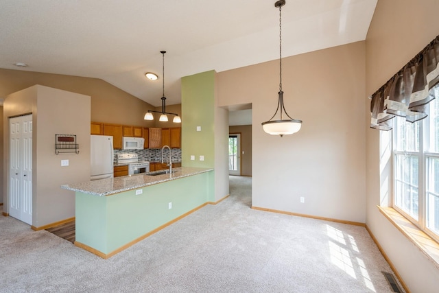 1005 Providence Dr, Shakopee, MN 55379 - kitchen with white appliances, light carpet, vaulted ceiling, baseboards, and backsplash
