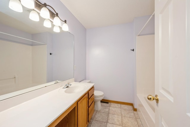 1005 Providence Dr, Shakopee, MN 55379 - full bathroom with toilet, vanity, baseboards, and shower / washtub combination