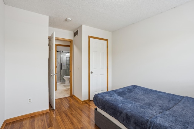 16480 Elm Creek Ln, Lakeville, MN 55044 - bedroom with wood finished floors and a textured ceiling