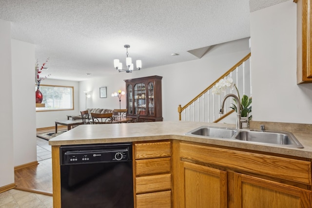 16480 Elm Creek Ln, Lakeville, MN 55044 - kitchen with dishwasher, a chandelier, a textured ceiling, a peninsula, and light countertops