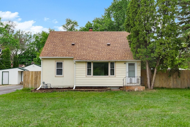 1915 Hazelwood St, Maplewood, MN 55109 - view of front of house with roof with shingles and a chimney