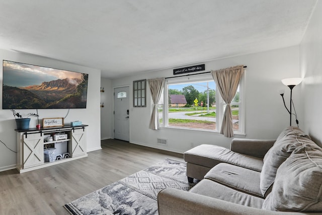 1915 Hazelwood St, Maplewood, MN 55109 - living room with wood finished floors and baseboards