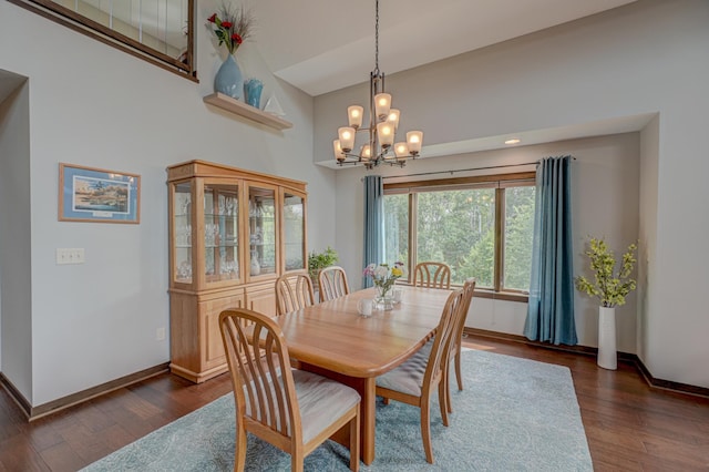1167 56th St, Hudson, WI 54016 - dining area featuring a chandelier, dark wood-style floors, and a towering ceiling