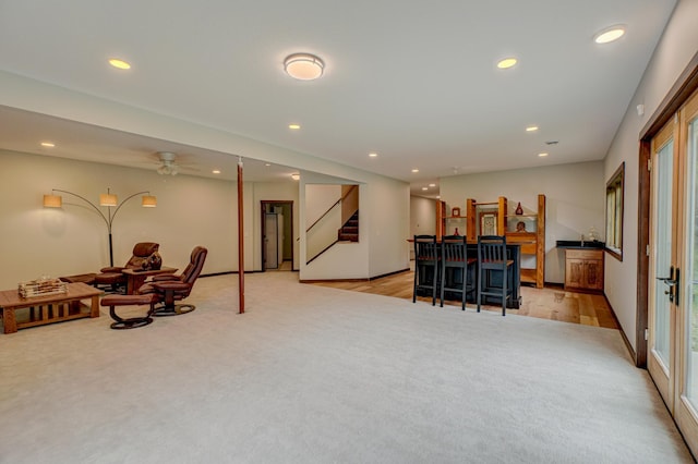 1167 56th St, Hudson, WI 54016 - living room with light carpet, recessed lighting, stairs, and a ceiling fan